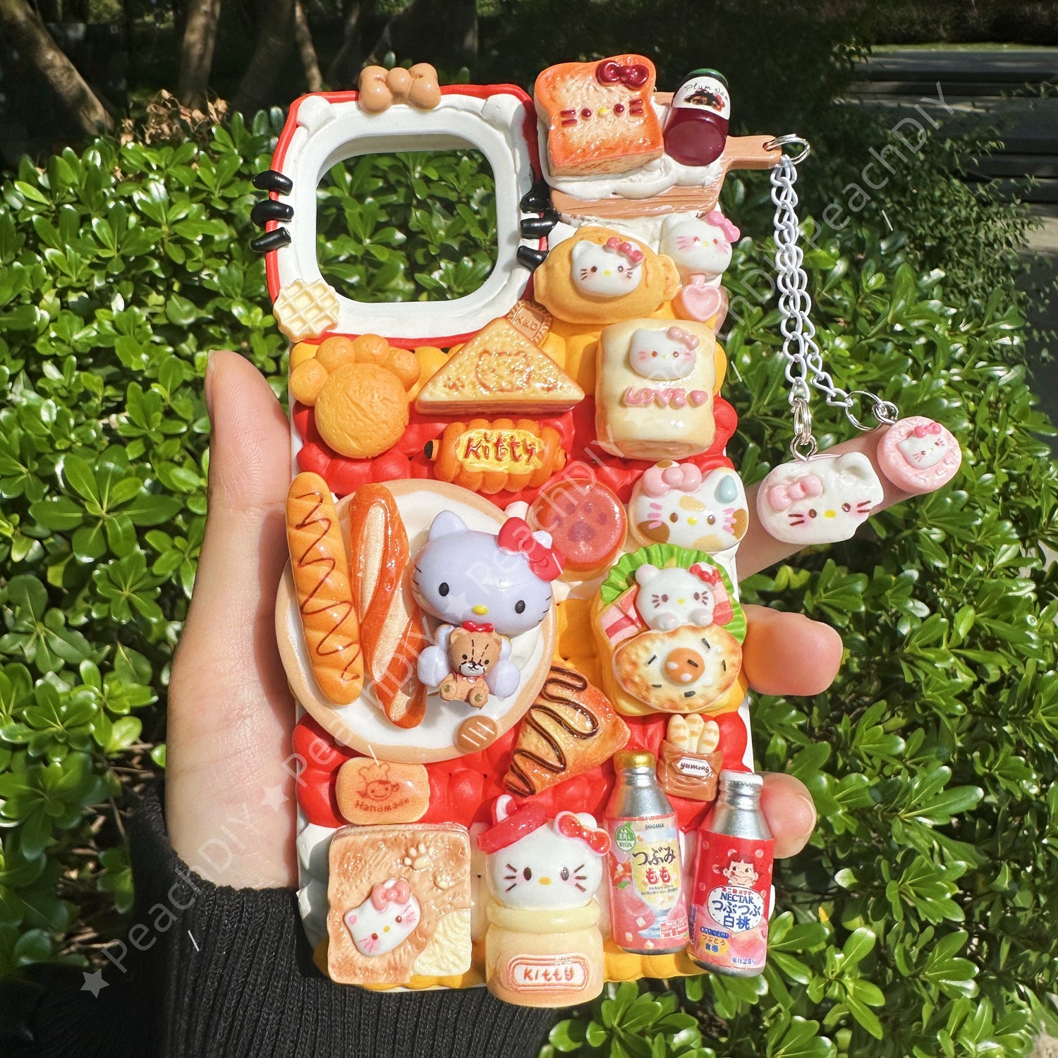 Handmade decoden phone case with food-themed  or sanrio charms