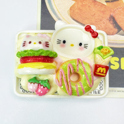 Miniature Pochacco and Hello Kitty fridge magnets